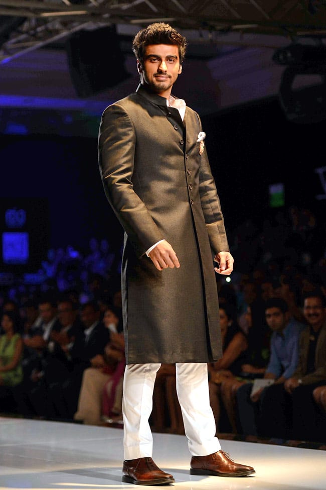black sherwani with shoes and white pant black sherwani with shoes and white pant