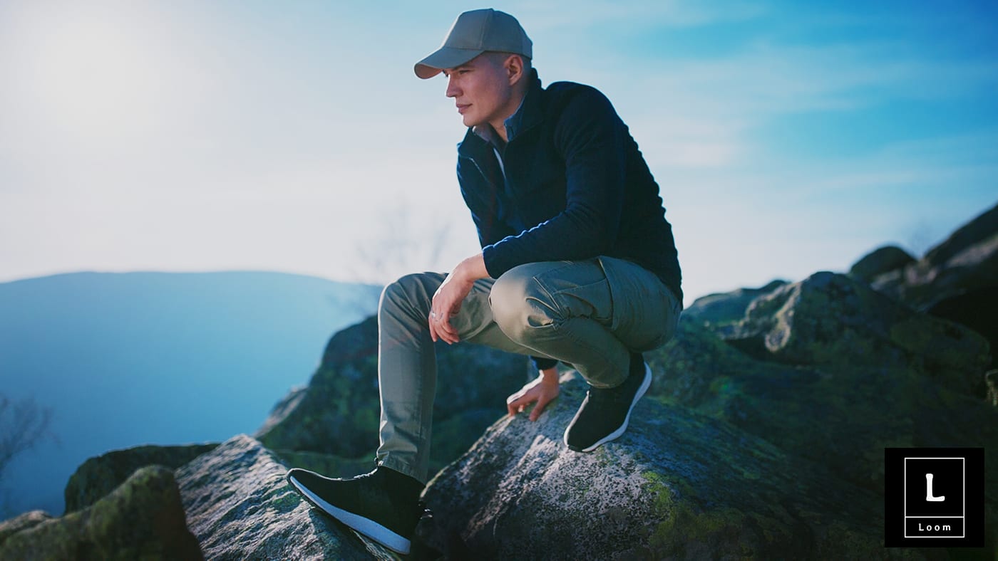 young-men-hicking-top-montain-black-sneakers-hat young-men-hicking-top-montain-black-sneakers-hat