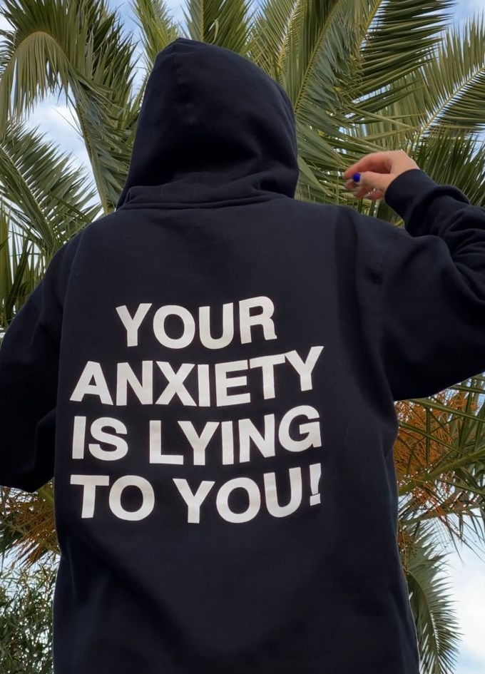 black colored thsirt with a quote written